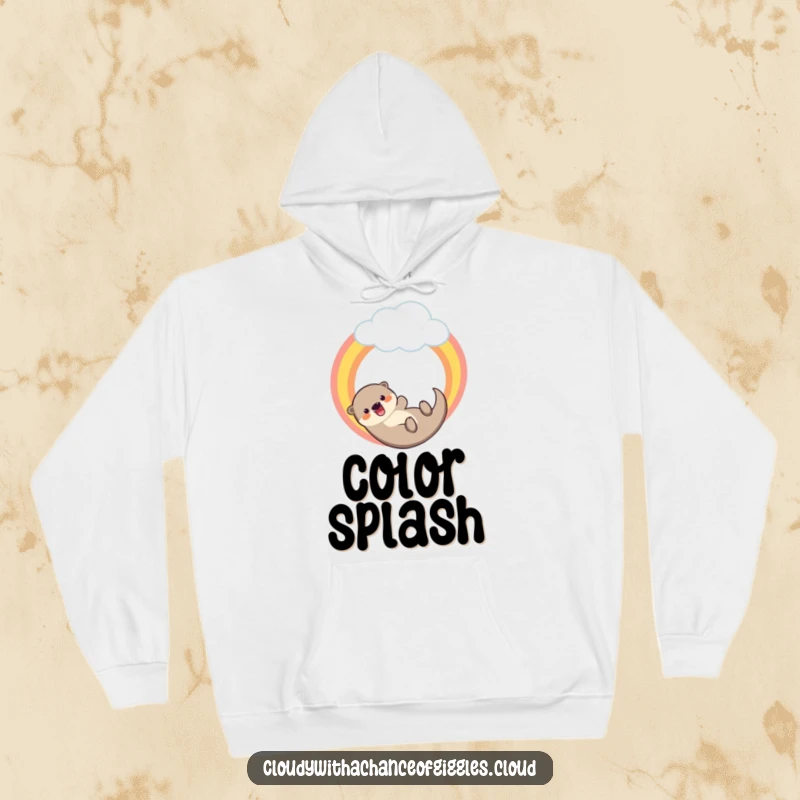 Funny hoodie showing a happy otter sliding down a vibrant rainbow extending from a cloud, designed for comfort and cheer.