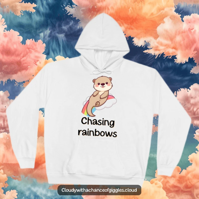 Funny playful otter slides down a rainbow from a fluffy cloud, depicted on this cozy and amusing hoodie.