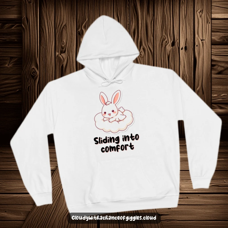Funny bunny hoodie designed with a cheerful bunny sliding down a cloud, offering warmth and adorable, humorous appeal.