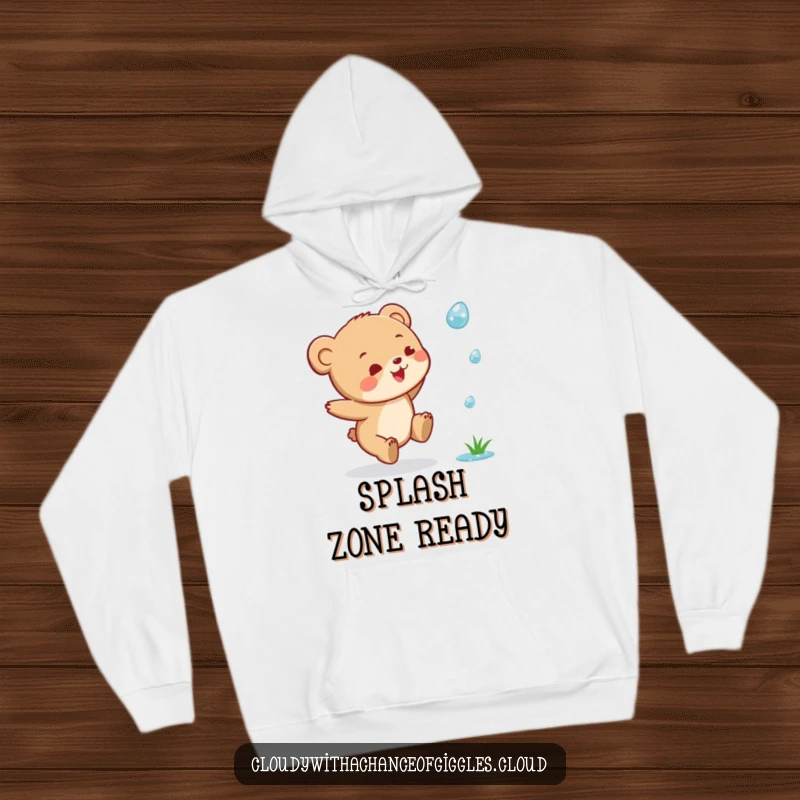 Funny Bear Cub Hoodie: A little bear cub caught in a happy leap while chasing a single raindrop, super cozy.