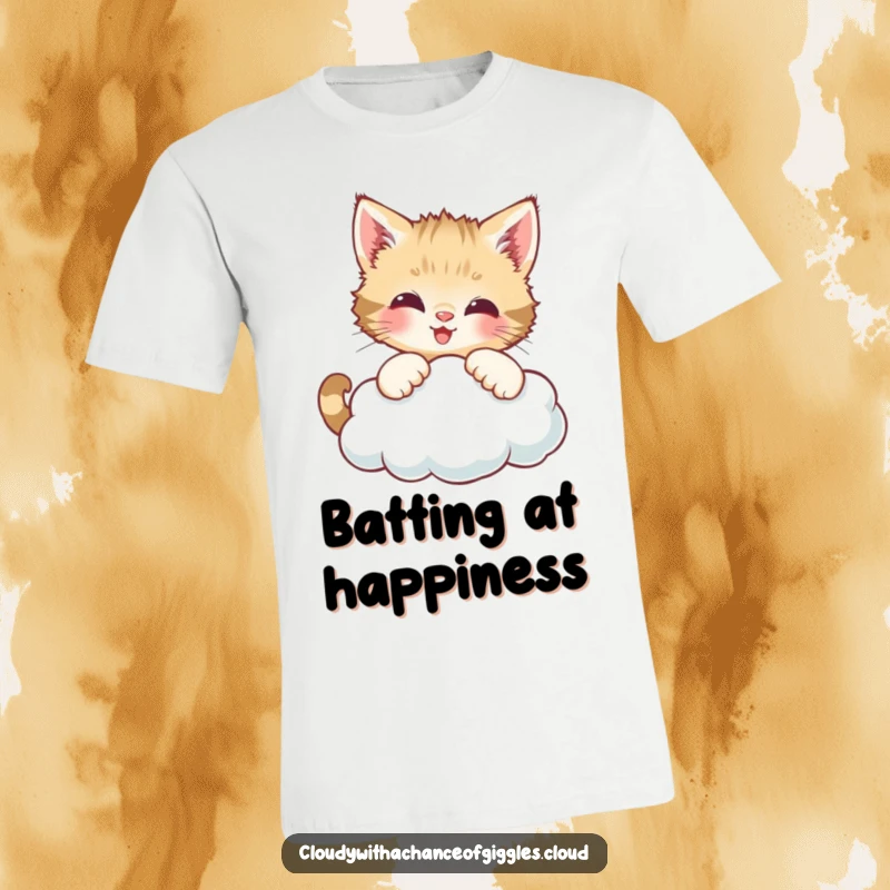 Funny t-shirt depicting a curious kitten playfully batting at a happy smiling cloud.