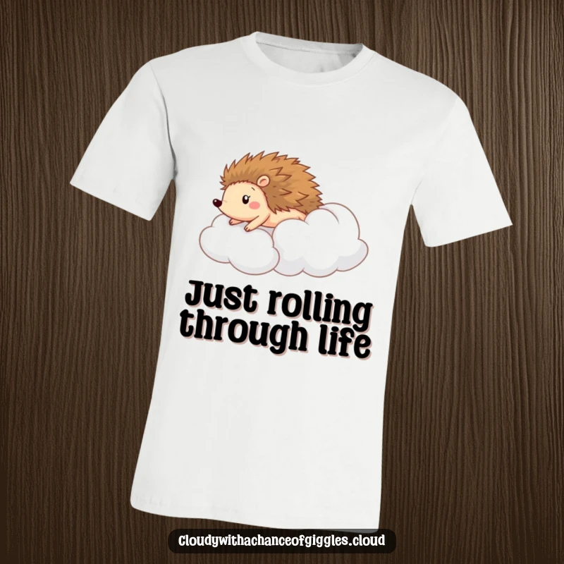 Funny t-shirt featuring a happy hedgehog rolling down a fluffy cloud like a hill, capturing a moment of pure delight.