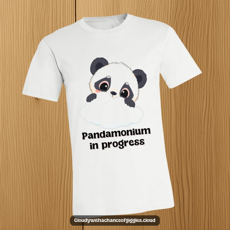 Funny panda cub t-shirt showing a curious panda cub with wide eyes peeking over the edge of a cloud, full of innocent wonder.